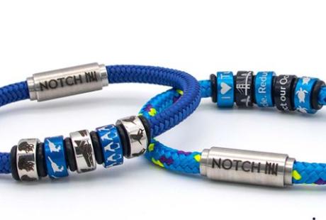 2 bracelets branded with The Deep and Notch