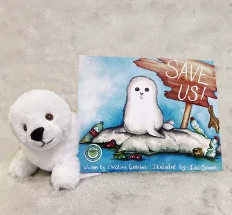 Save us! Book by Christina Gabbitas and soft white fluffy seal plush