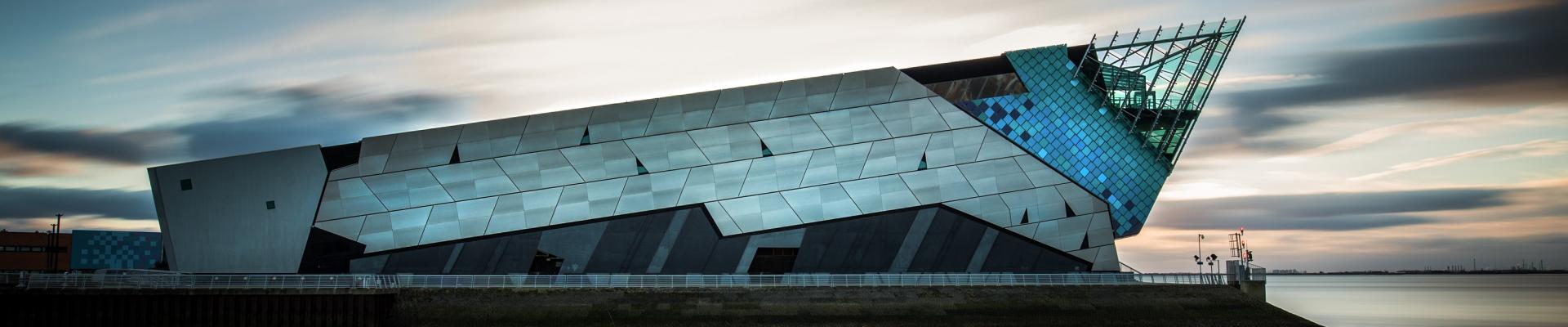 The Deep building exterior overlooking the Humber Estuary at dusk.